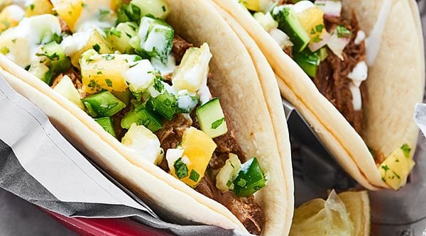 Slow Cooker Carnitas. An easy, flavorful, healthy meal made in the crockpot. Tender pork served in your favorite tortilla and topped with a homemade salsa? Gimme! showmetheyummy.com #porkcarnitas #slowcookercarnitas